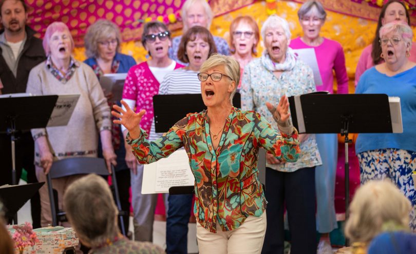 A choir singing at Skanda Vale Hospice summer fete